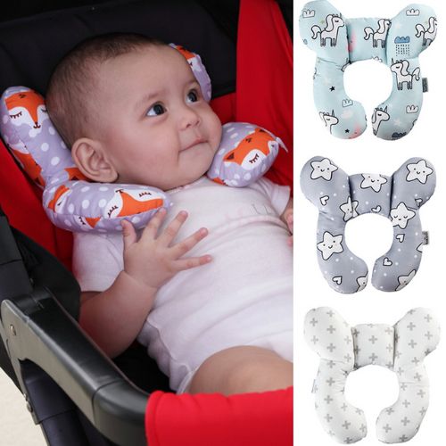 Baby travel pillow supporting an infant head in a car seat