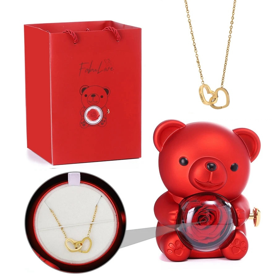 Teddy bear made of roses in a gift box with a necklace