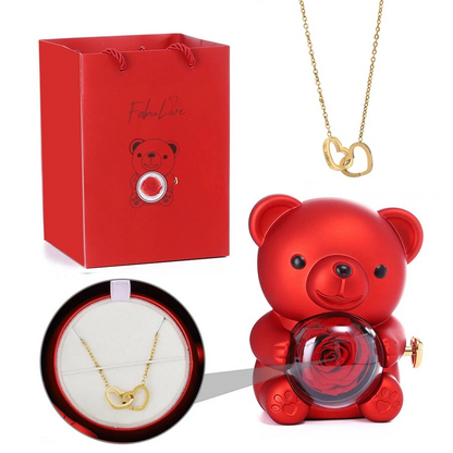 Teddy bear made of roses in a gift box with a necklace